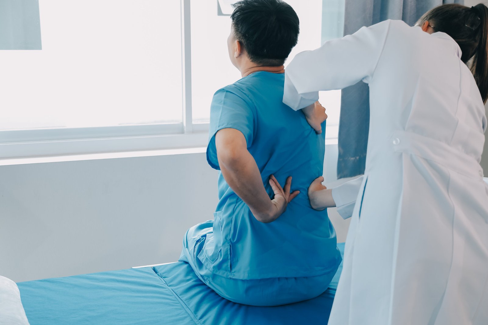Patient doing some special exercises under supervision in a room